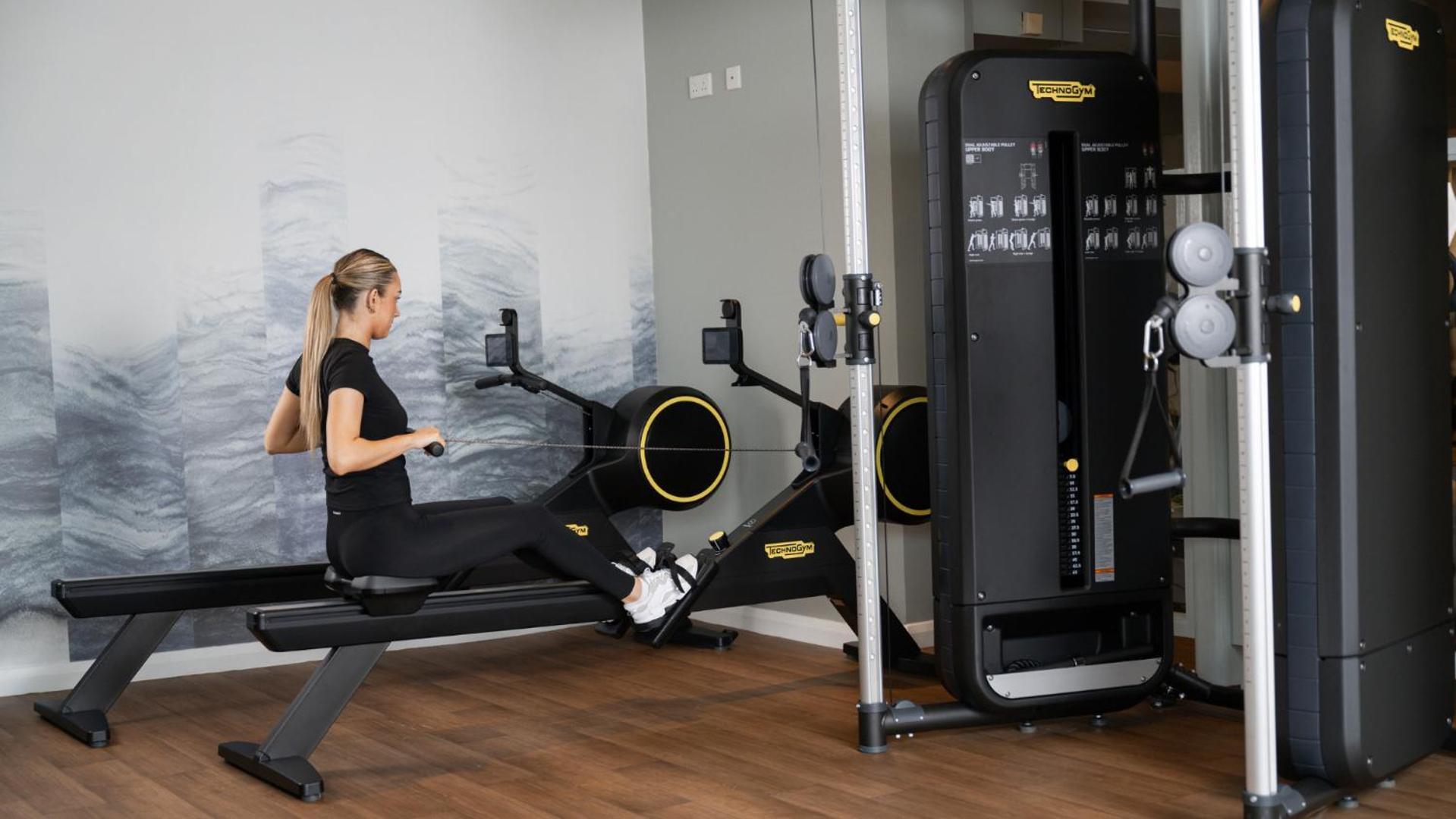 The Culloden Estate And Spa Holywood  Extérieur photo A woman using a rowing machine