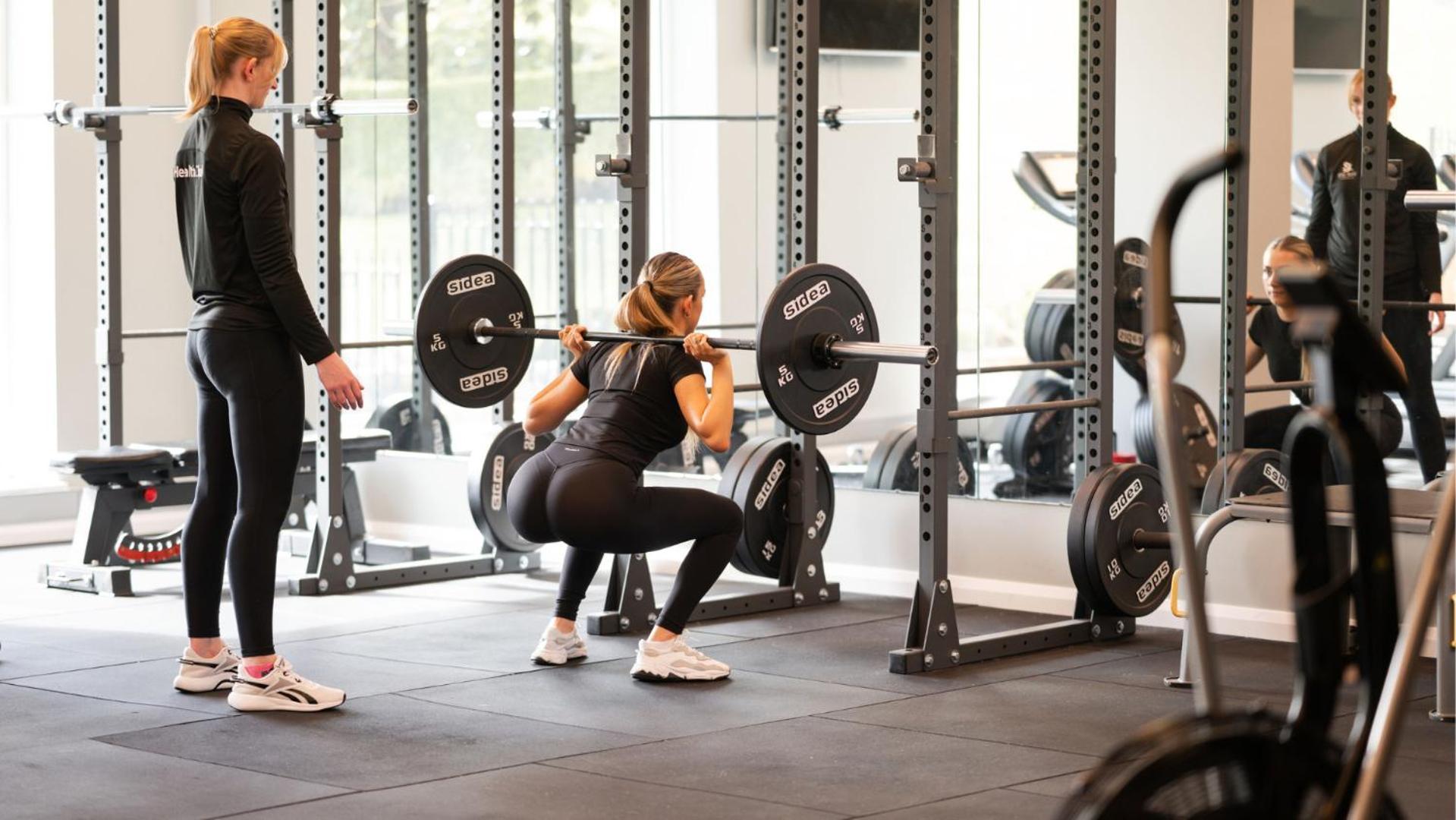 The Culloden Estate And Spa Holywood  Extérieur photo A woman performing a back squat with a barbell